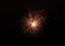 A firework exploding in the night sky
