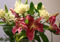 a bouquet of pink lilies and white roses