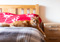 long-haired ginger cat lying on a bed
